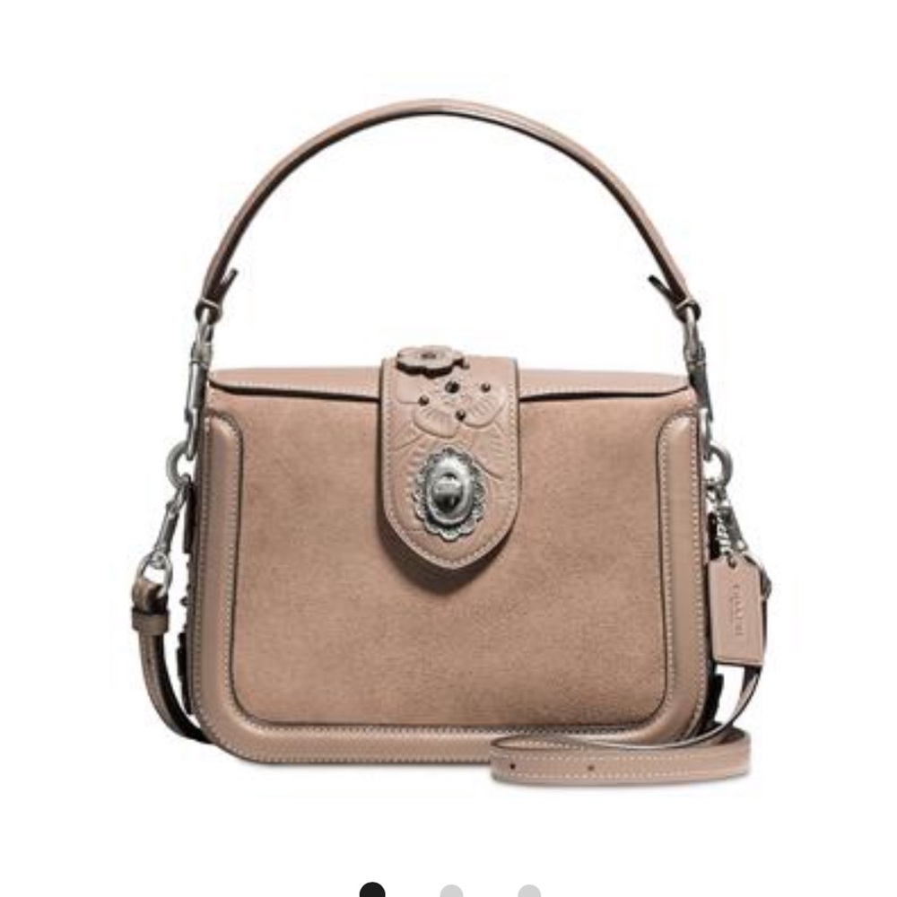 Coach crossbody handbag glovetanned leather. a brownish color